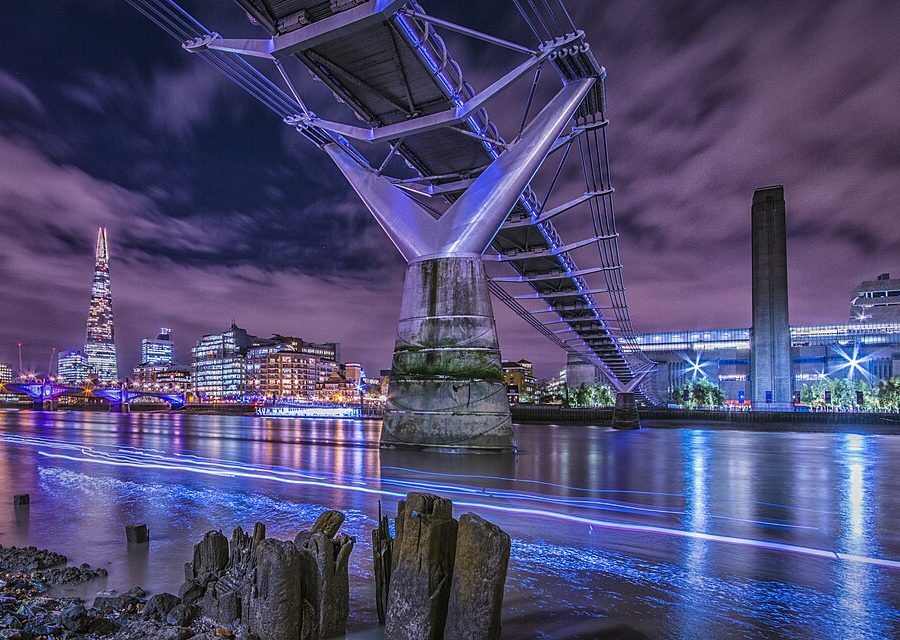 Suspension bridge civic lighting layered onto a structural safety upgrade