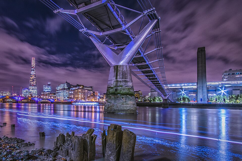 Suspension bridge civic lighting layered onto a structural safety upgrade